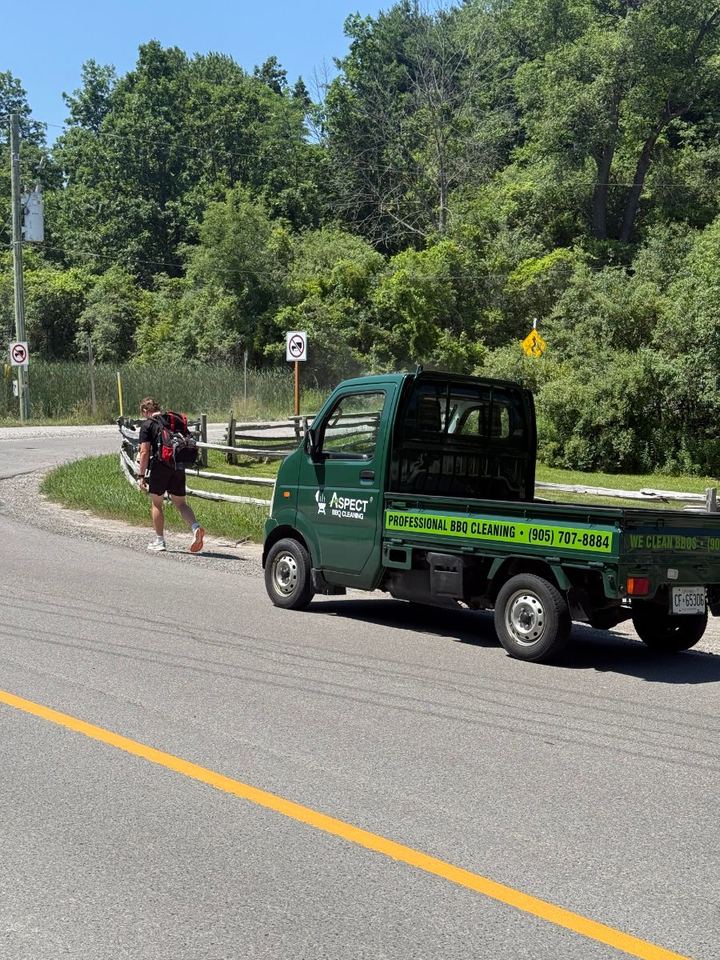Jacob rucking the back roads beside the Aspect truck